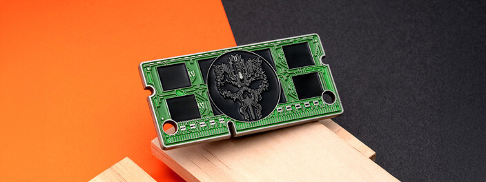 Green coin shaped and colored like a memory module, with a black circuit trace skull at the center