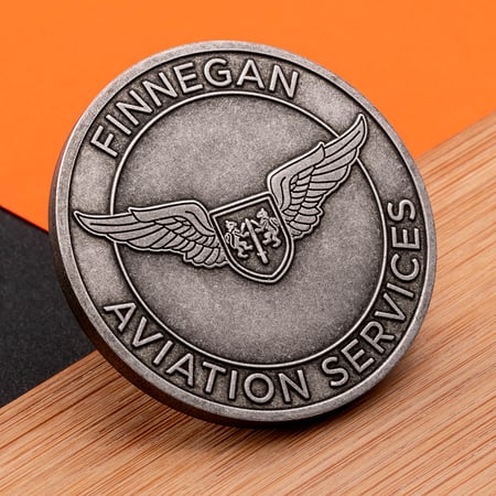 American made challenge coin with Finnegan Aviation's logo