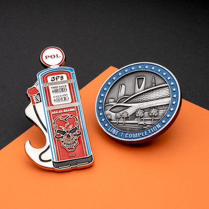 Red and blue fuel pump shaped coin with a skull beside an antique silver coin of a stadium and palm trees