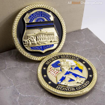 Two antique honor guard coins with a badge and eagle design