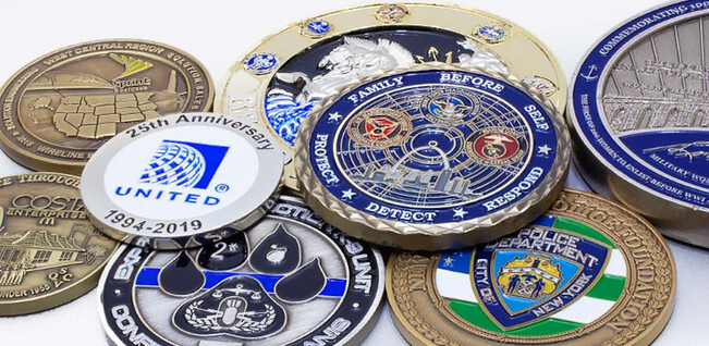 Pile of round full-color challenge coins from different units and companies