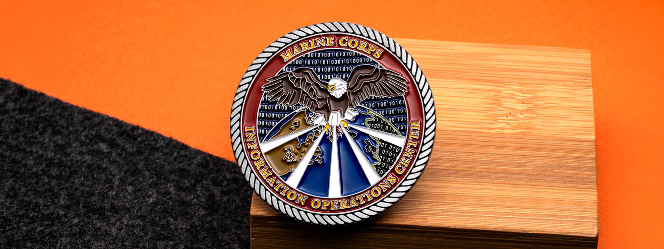 Antique silver Marine Information Operations Center coin with a bald eagle over a globe and binary code