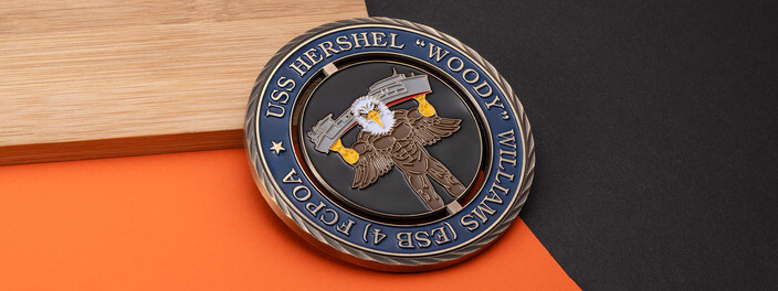 Antique bronze spinner coin for the USS Hershel "Woody" Williams with a muscled bald eagle lifting the ship