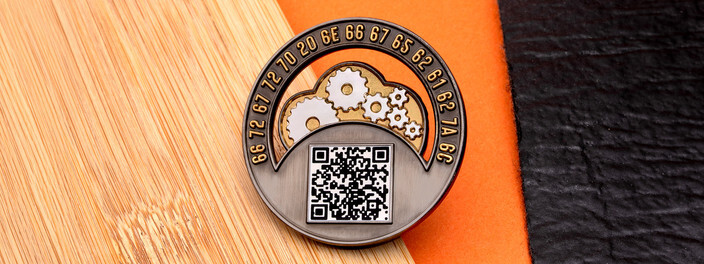 Antique silver arched coin with gold gears over a QR code, ringed by a line of hexadecimal code