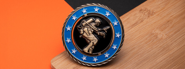 Blue star ring around a sculpted bronze soldier with a flamethrower on a spinning center, on bamboo