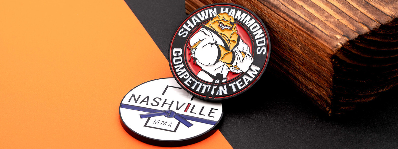 Black and red martial arts team coin with a bulldog in a white gi, over a white coin with a blue belt